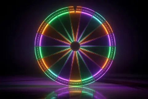 A multicoloured neon wheel stands on a dark reflective stage.
